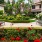a bench in a garden with Lombard Street in the background
