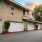 a building with garages and trees