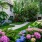 a garden with flowers and trees