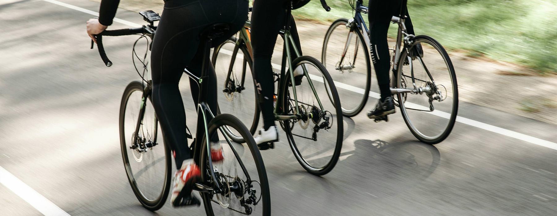 a group of people riding bikes