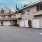 a row of buildings with white garages